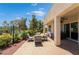 Outdoor patio with dining furniture, ceiling fan and views of the green landscape at 352 Angels Trace Ct, Las Vegas, NV 89148