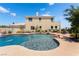 Spacious backyard with a large pool and lush landscaping, perfect for outdoor entertaining at 352 Angels Trace Ct, Las Vegas, NV 89148