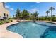 Inviting pool area with beautiful landscaping, steps into pool, and outdoor seating at 352 Angels Trace Ct, Las Vegas, NV 89148