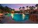 Beautiful pool featuring a rock waterfall and integrated spa for relaxation and entertainment at 352 Angels Trace Ct, Las Vegas, NV 89148