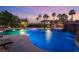 Stunning pool featuring a waterfall, integrated hot tub, and poolside cabana at 352 Angels Trace Ct, Las Vegas, NV 89148