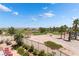 Scenic view of a lush golf course from a well-manicured backyard at 352 Angels Trace Ct, Las Vegas, NV 89148