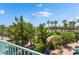Balcony view of lush landscaping and distant golf course at 352 Angels Trace Ct, Las Vegas, NV 89148