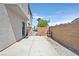 Spacious backyard with a concrete patio, privacy fence, and endless potential for outdoor activities and relaxation at 3591 Gloucester Gate St, Las Vegas, NV 89122
