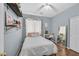 Bright bedroom features a ceiling fan and a vanity with mirror at 3591 Gloucester Gate St, Las Vegas, NV 89122
