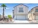 Two-story home with an attached garage and a well-maintained front yard at 3591 Gloucester Gate St, Las Vegas, NV 89122