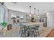 Contemporary kitchen featuring a central island with seating and modern light fixtures at 3591 Gloucester Gate St, Las Vegas, NV 89122