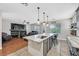 Bright and airy living space connected to the kitchen, showcasing a fireplace and natural light at 3591 Gloucester Gate St, Las Vegas, NV 89122