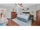 Spacious bedroom boasts a ceiling fan, wood floors, and ample natural light at 3591 Gloucester Gate St, Las Vegas, NV 89122