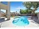 Private backyard oasis with a sparkling pool, inviting lounge area, and mature trees for shade and privacy at 3591 Gloucester Gate St, Las Vegas, NV 89122