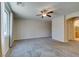 Large bedroom features soft carpet, ceiling fan, and a window at 368 Calabria Beach St, Henderson, NV 89015