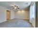 Large bedroom features soft carpet, ceiling fan, and a window at 368 Calabria Beach St, Henderson, NV 89015
