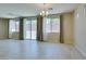 Spacious dining area with tile floors, multiple windows and backyard view, and neutral walls at 368 Calabria Beach St, Henderson, NV 89015