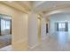 Bright hallway featuring modern tile flooring, arched doorways, and neutral wall colors at 368 Calabria Beach St, Henderson, NV 89015