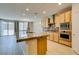 Bright kitchen features a large island and stainless steel appliances at 368 Calabria Beach St, Henderson, NV 89015