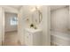 Bathroom view, highlighting a modern vanity with gold accents and a stylish, tiled shower-tub combination at 3748 Silent Hill Dr, Las Vegas, NV 89147