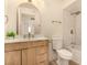 Bright bathroom featuring a wooden vanity, modern fixtures, and marble tiled shower and bathtub at 3748 Silent Hill Dr, Las Vegas, NV 89147
