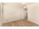 Neutral bedroom offers wood floors, ceiling fan, window, and ample space at 3748 Silent Hill Dr, Las Vegas, NV 89147