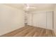 Spacious bedroom features wood-look flooring, neutral colors, and a closet with sliding doors at 3748 Silent Hill Dr, Las Vegas, NV 89147