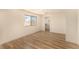 Bright bedroom with wood floors and large window at 3748 Silent Hill Dr, Las Vegas, NV 89147