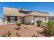 Charming single-story home featuring a gravel front yard, desert landscaping, and an attached two-car garage at 3748 Silent Hill Dr, Las Vegas, NV 89147
