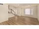 Open living area featuring modern wood floors, a freshly painted interior, a staircase, and plenty of light at 3748 Silent Hill Dr, Las Vegas, NV 89147