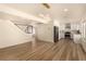 Open-concept living space featuring new wood flooring, fresh paint, modern lighting, and an updated kitchen at 3748 Silent Hill Dr, Las Vegas, NV 89147