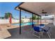 Inviting backyard with a pool, patio cover, and dining area, perfect for outdoor relaxation at 3748 Silent Hill Dr, Las Vegas, NV 89147