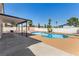 Relaxing backyard showcasing a pool, covered patio, and dining setup for ultimate outdoor enjoyment at 3748 Silent Hill Dr, Las Vegas, NV 89147