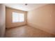 Neutral bedroom with light walls, tiled floor, and window with blinds at 3790 W Moberly Ave, Las Vegas, NV 89139