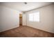 Bright bedroom with carpet, a window with blinds, and a closet with open door at 3790 W Moberly Ave, Las Vegas, NV 89139