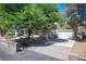 A lovely single story home with attached two-car garage and lush trees for shade at 3790 W Moberly Ave, Las Vegas, NV 89139