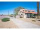 A single story home with red tile roof and gated entrance at 3790 W Moberly Ave, Las Vegas, NV 89139