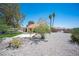 Charming single-story home featuring desert landscaping, mature trees, and a vibrant green lawn area at 3790 W Moberly Ave, Las Vegas, NV 89139