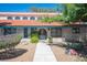 Landscaped front yard with desert plants leads to the home's inviting arched doorway at 3790 W Moberly Ave, Las Vegas, NV 89139