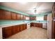 Spacious kitchen with light walls, wooden cabinetry, and modern appliances at 3790 W Moberly Ave, Las Vegas, NV 89139