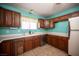 Bright kitchen features stainless steel appliances, white countertops and tiled floors at 3790 W Moberly Ave, Las Vegas, NV 89139