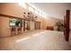 Spacious living room with tile floors, high ceilings, and stylish chandelier at 3790 W Moberly Ave, Las Vegas, NV 89139