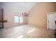 Large living area featuring fireplace, big windows, and tiled floors for a cozy vibe at 3790 W Moberly Ave, Las Vegas, NV 89139