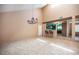 Living room with a seamless connection to kitchen with bar-style seating at 3790 W Moberly Ave, Las Vegas, NV 89139