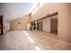 Open-concept living area boasts natural light, tiled flooring, and seamless flow to other rooms at 3790 W Moberly Ave, Las Vegas, NV 89139