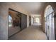 Covered patio features sliding glass doors, arched openings, and iron security bars at 3790 W Moberly Ave, Las Vegas, NV 89139