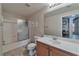 Bathroom featuring a shower and bathtub combo, toilet, mirror, and a sink at 3975 N Hualapai Way # 121, Las Vegas, NV 89129