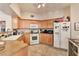 Functional kitchen with linoleum floors, complete with essential appliances and cabinetry at 3975 N Hualapai Way # 121, Las Vegas, NV 89129