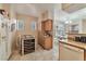 Bright eat-in kitchen featuring a tile floor and standard dishwasher and refrigerator at 3975 N Hualapai Way # 121, Las Vegas, NV 89129