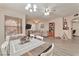 Open-concept living room, dining room, with lovely wood floors at 3975 N Hualapai Way # 121, Las Vegas, NV 89129