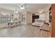 Spacious living room with wood floors, fan, and dining area at 3975 N Hualapai Way # 121, Las Vegas, NV 89129