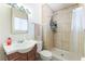 Bathroom featuring tiled shower, single vanity, and natural lighting at 409 Antelope Way, Las Vegas, NV 89145