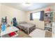 Cozy bedroom featuring a comfortable bed, study space and decor at 409 Antelope Way, Las Vegas, NV 89145