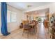 Cozy dining area featuring a classic wooden table set, tile floors, and natural light at 409 Antelope Way, Las Vegas, NV 89145